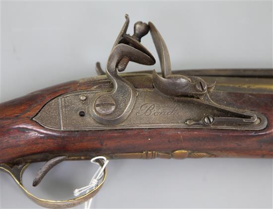 A late 18th century flintlock blunderbuss with sprung bayonet and brass barrel, 29in.